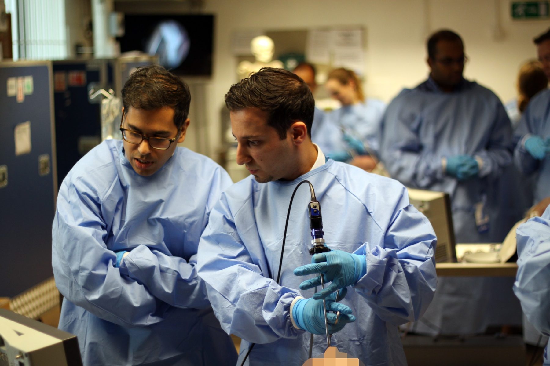 Delegates in the laboratory using endoscopic equipment